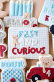 Decorative cookies with text and graphics on a beige background